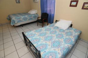 Ένα ή περισσότερα κρεβάτια σε δωμάτιο στο San Felipe Studio 4 FREE WIFI AND CABLE TV