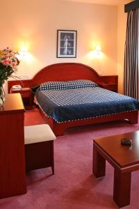 Säng eller sängar i ett rum på Kornilios Istron Hotel