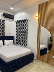 Кровать или кровати в номере Hideout, Wuye