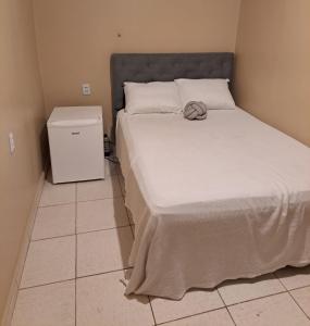 Ένα ή περισσότερα κρεβάτια σε δωμάτιο στο Quarto casal -próximo dos principais pontos turísticos