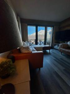 Postel nebo postele na pokoji v ubytování Les Ecureuils Squirrel Lodge