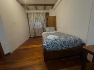 Giường trong phòng chung tại Exedra de Galeria Cafe. Mindo- Ecuador