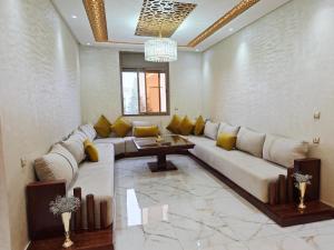 Ένα ή περισσότερα κρεβάτια σε δωμάτιο στο Azur appartement essaouira