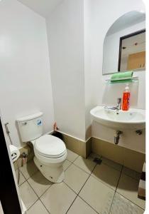 a bathroom with a toilet and a sink at Casa Mira Mandaue unit 608 Tower 4 in Cebu City