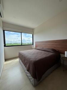 Postel nebo postele na pokoji v ubytování Hotel 56 Zuna