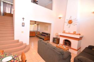 a living room with a fireplace and couches at Casa Rubio del Mar - Monthly Rentals Welcome in San Felipe