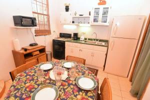 a kitchen with a table with plates on it at Casa Rubio del Mar - Monthly Rentals Welcome in San Felipe +19 photos