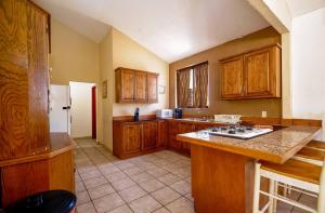 a kitchen with wooden cabinets and a counter top at 3 bedroom Beach side home away from home in San Felipe