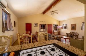 a kitchen and living room with a stove top at 3 bedroom Beach side home away from home in San Felipe +23 photos