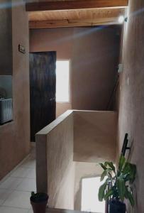 a room with a door and a potted plant at El Shaddai I in Santiago del Estero