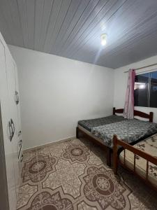 Ένα ή περισσότερα κρεβάτια σε δωμάτιο στο Aconchego palma