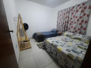 Postel nebo postele na pokoji v ubytování Aconchego de vó