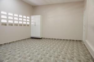 an empty room with white walls and a tile floor at Cozy Stay in Paramaribo North in Paramaribo