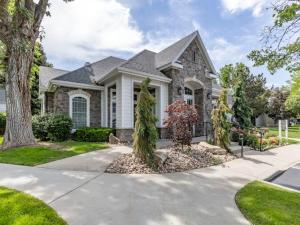 a stone house with a driveway in front of it at 20 Minutes to Skiing in Midvale