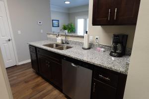 a kitchen with a sink and a counter top at 20 Minutes to Skiing in Midvale