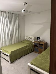 Ένα ή περισσότερα κρεβάτια σε δωμάτιο στο mirante del cerro