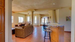 a living room with a couch and a table at Casa La Vida Dulce in El Dorado Ranch San Felipe. 18-Hole Golf Course in Playa El Paraíso