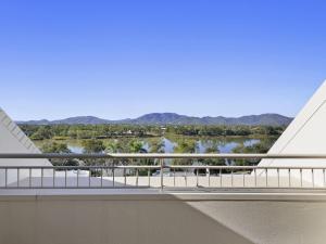 a balcony with a view of a river and mountains at Mercure Rockhampton in Rockhampton