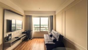 Μια τηλεόραση ή/και κέντρο ψυχαγωγίας στο Hotel Aeroporto Stay Here