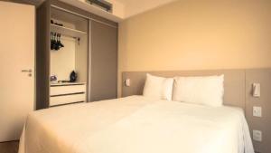 Ένα ή περισσότερα κρεβάτια σε δωμάτιο στο Hotel Aeroporto Stay Here