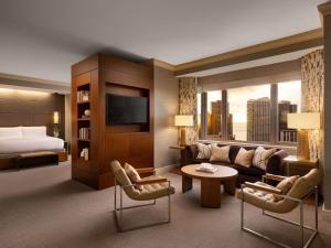 a hotel room with a couch and a bed at Fairmont Chicago Millennium Park in Chicago +180 photos