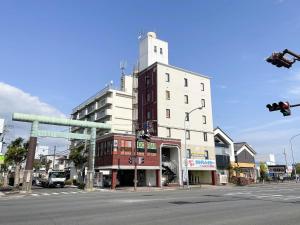 a building on a city street with a traffic light at Rakuda Hotel Jinguu - Vacation STAY 97183v in Miyazaki