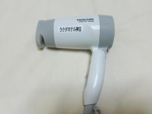 a white hair dryer hanging on a wall at Rakuda Hotel Jinguu - Vacation STAY 97183v in Miyazaki +22 photos
