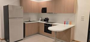 Kuchyň nebo kuchyňský kout v ubytování Goldena Residence Pool Villas