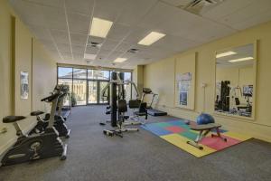 a gym with treadmills and exercise equipment in a room at Amazing View Beach Front King Bed in Panama City Beach