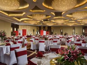 a banquet hall with white tables and chairs and chandeliers at Swissotel Foshan, Guangdong - Free shuttle to Canton Fair in Foshan +122 photos