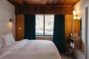 Postel nebo postele na pokoji v ubytování Eiger Chalet