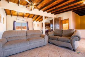 a living room with a couch and two chairs at Condo 4, In town and steps to the beach and Malecon in San Felipe