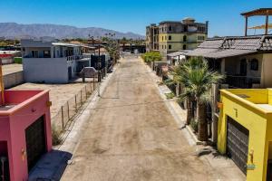 an empty street in a city with buildings at Condo 4, In town and steps to the beach and Malecon in San Felipe