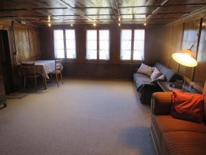 a living room with a couch and a table at Biohof Langberg in Lauerz