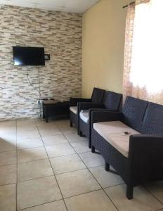 TV a/nebo společenská místnost v ubytování House Aura`s