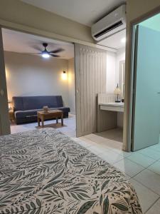 Ένα ή περισσότερα κρεβάτια σε δωμάτιο στο La baie de GOYAVE