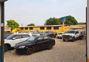 a group of cars parked in a parking lot at Araguaia Plaza Hotel in Conceição do Araguaia