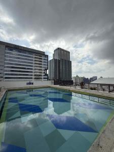 a large swimming pool on the roof of a building at Penthouse A Near IT Park in Cebu City