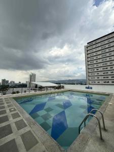 a swimming pool on the roof of a building at Penthouse A Near IT Park in Cebu City