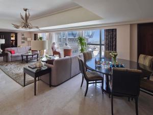 a living room with a couch and a table at Makkah Clock Royal Tower, A Fairmont Hotel in Makkah +274 photos
