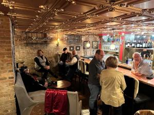 a group of people sitting at a bar at The Inn at Southern Oaks in Lavonia