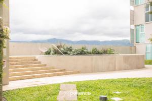a set of stairs in front of a building at Firefly at 29, City Views and Wonderland Vibes! in Hatillo +45 photos