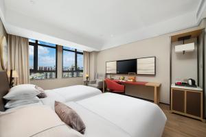 Φωτογραφία από το άλμπουμ του 南宁江南万达白沙大道怡程酒店 σε Νανίνγκ