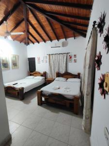 Postel nebo postele na pokoji v ubytování Hotel Campestre la Meseta