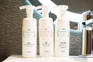three bottles of sunscreen sitting on a counter at Disney Style Hotel "J Hotel" - Vacation STAY 17216v in Chiba
