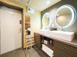 a bathroom with two sinks and a large mirror at Disney Style Hotel "J Hotel" - Vacation STAY 17216v in Chiba