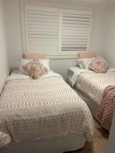 Ένα ή περισσότερα κρεβάτια σε δωμάτιο στο Ettalong Beach