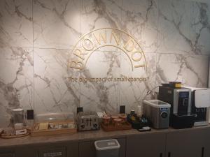 a room with a counter with a sign on a wall at browndot 서천 