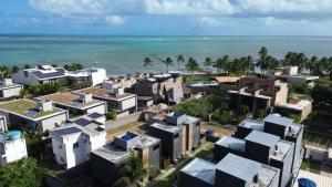 an aerial view of houses in front of the ocean at MHV Milagres - Studio Guadalupe 11 in Passo de Camarajibe