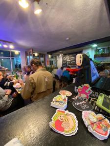 a bar with plates of food on a counter at Posada Los Olivos in Baños